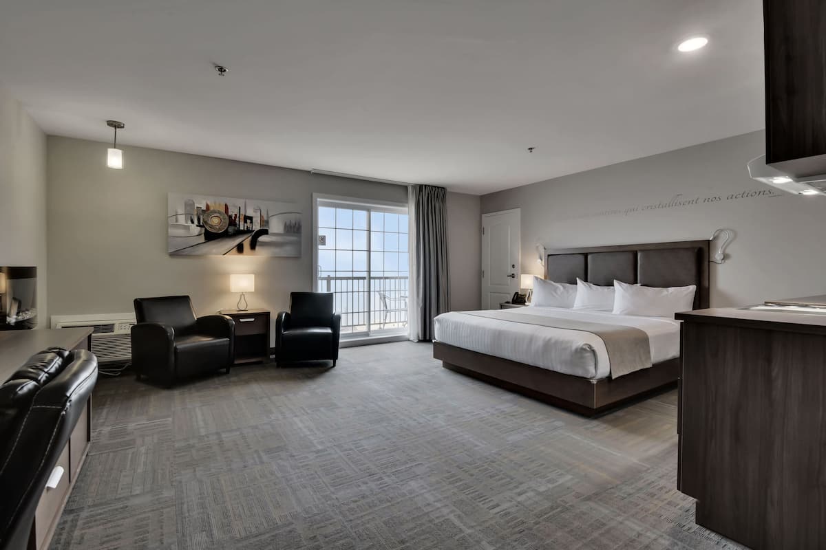 hotel | suite 1 king bed river view | 1 bedroom, in-room safe, individually decorated, individually furnished