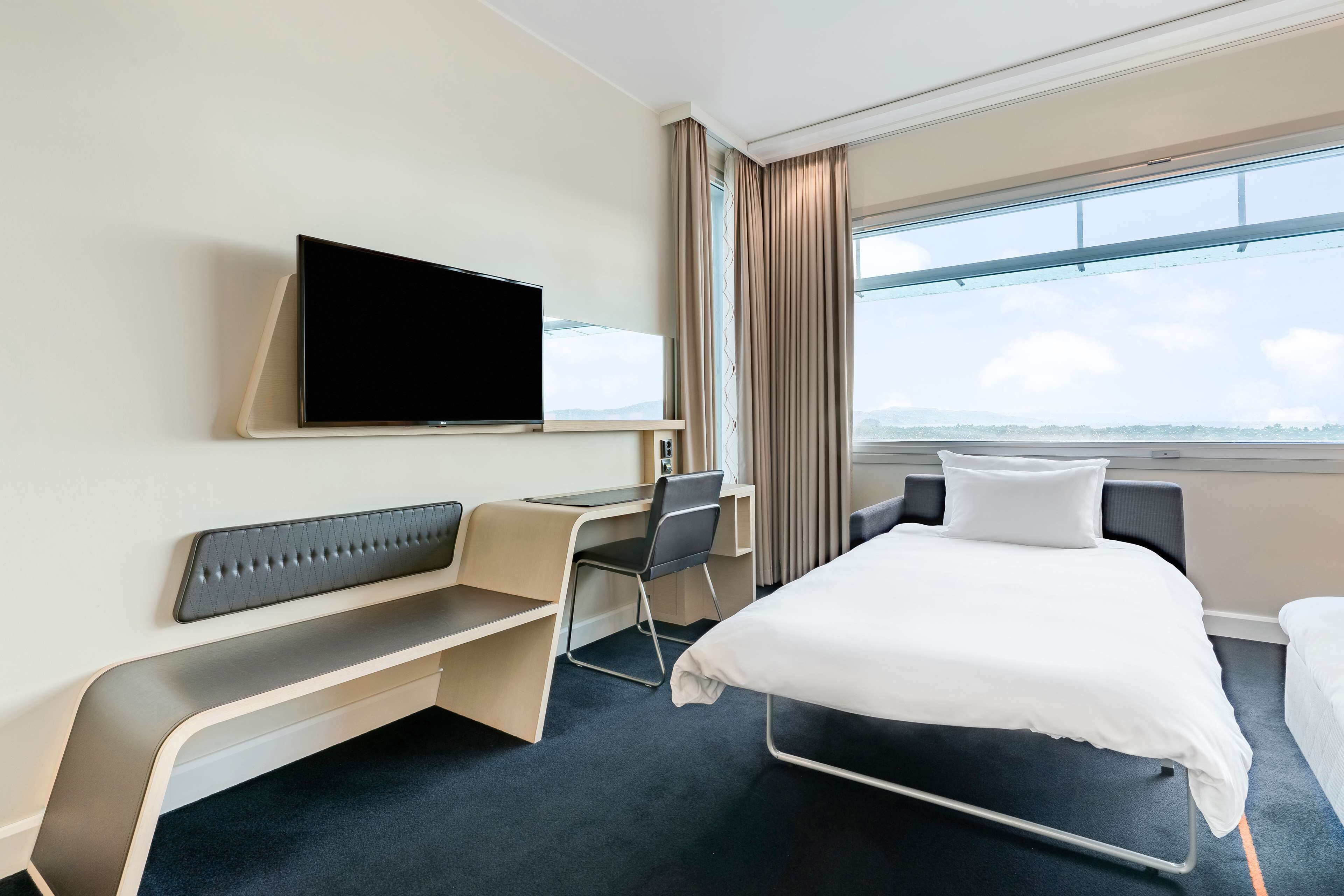 family room (fjord & runway view) | premium bedding, down duvets, pillow-top beds, minibar