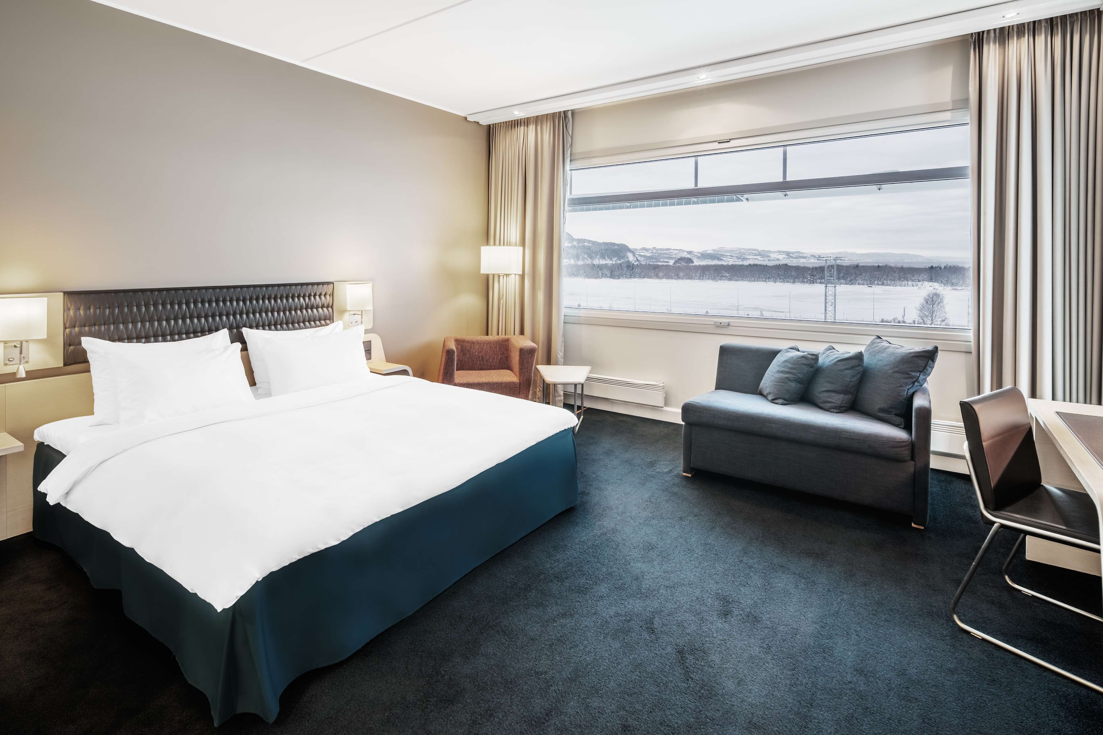 premium room (fjord & runway view) | premium bedding, down duvets, pillow-top beds, minibar