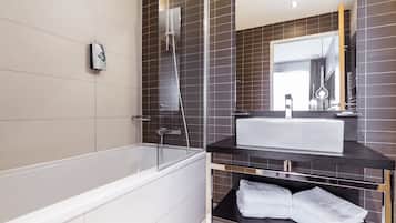 Bathtub, rainfall showerhead, eco-friendly toiletries, hair dryer