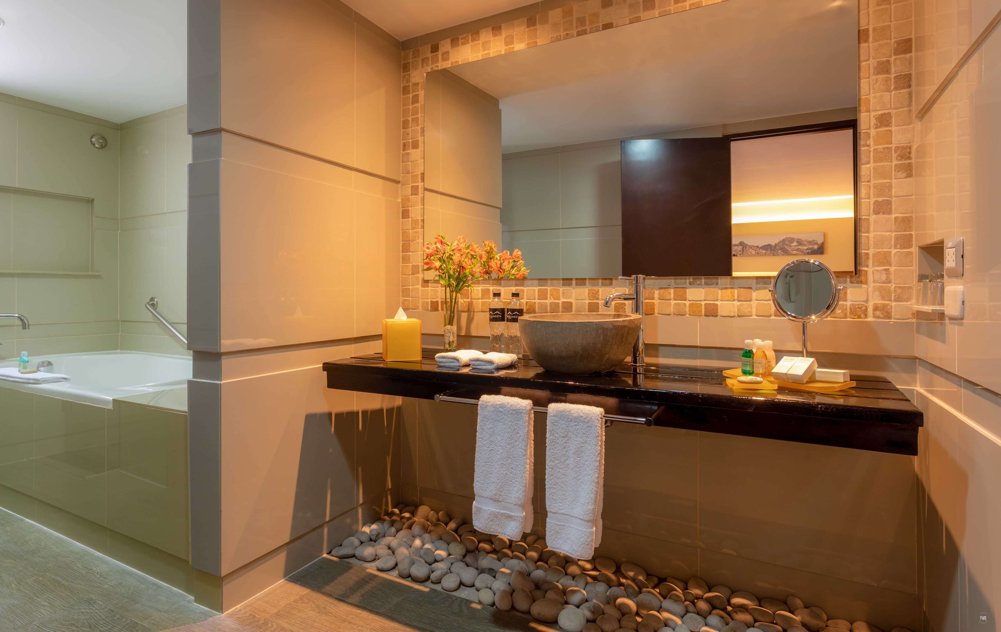 combined shower/bathtub, deep-soaking bathtub, rainfall showerhead