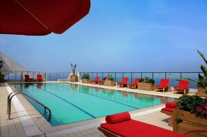 Seasonal outdoor pool, open 10:00 AM to 7 PM, pool umbrellas