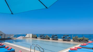Seasonal outdoor pool, open 10:00 AM to 7 PM, pool umbrellas