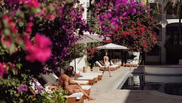 Outdoor pool, open 8:00 AM to 8:00 PM, pool umbrellas, pool loungers