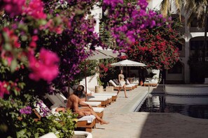 Outdoor pool, open 8:00 AM to 8:00 PM, pool umbrellas, sun loungers - Tropicana Los Cabos, Tapestry Collection by Hilton (San José del Cabo)