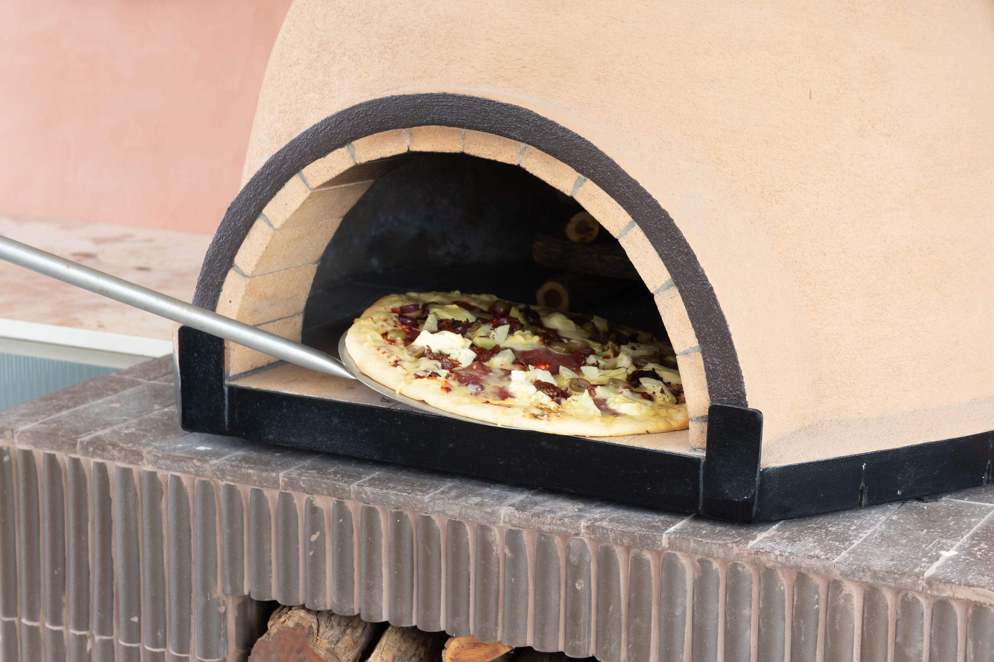 A pizza oven with a pizza inside.