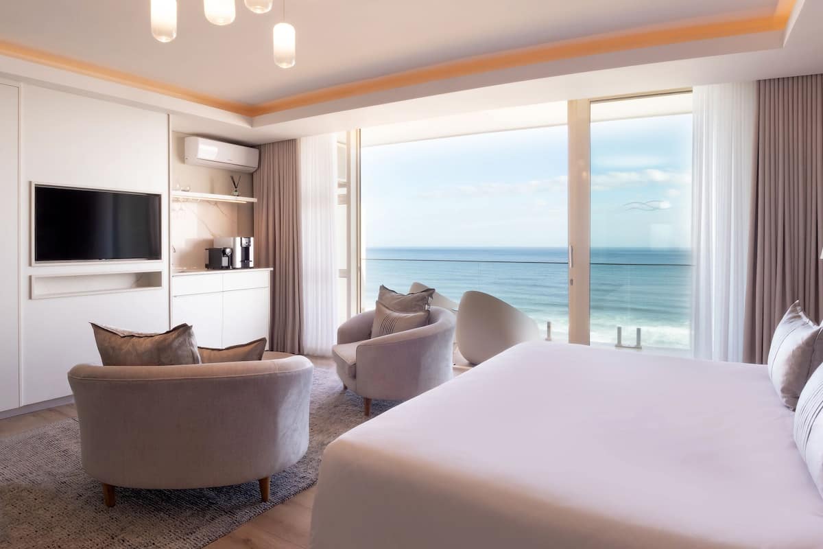 sea facing suite | premium bedding, minibar, in-room safe, individually decorated