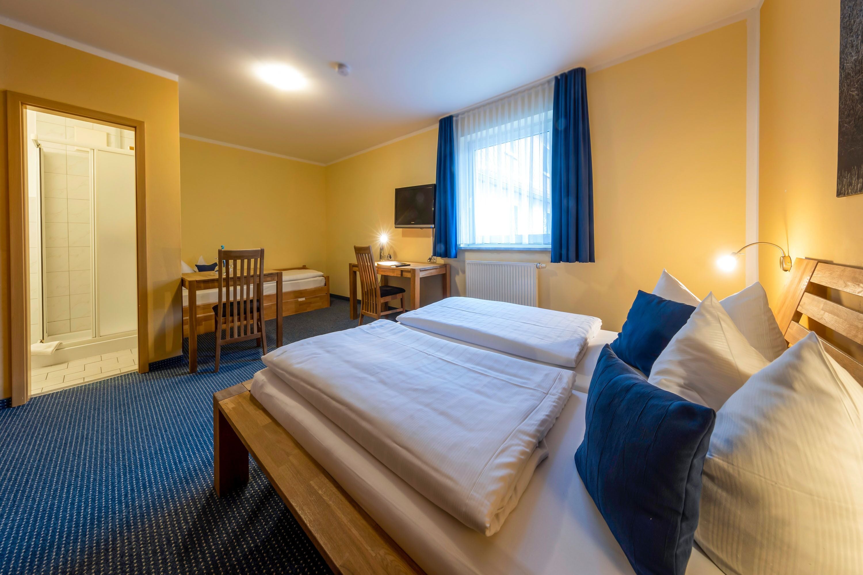 triple room | in-room safe, desk, free cots/infant beds, rollaway beds