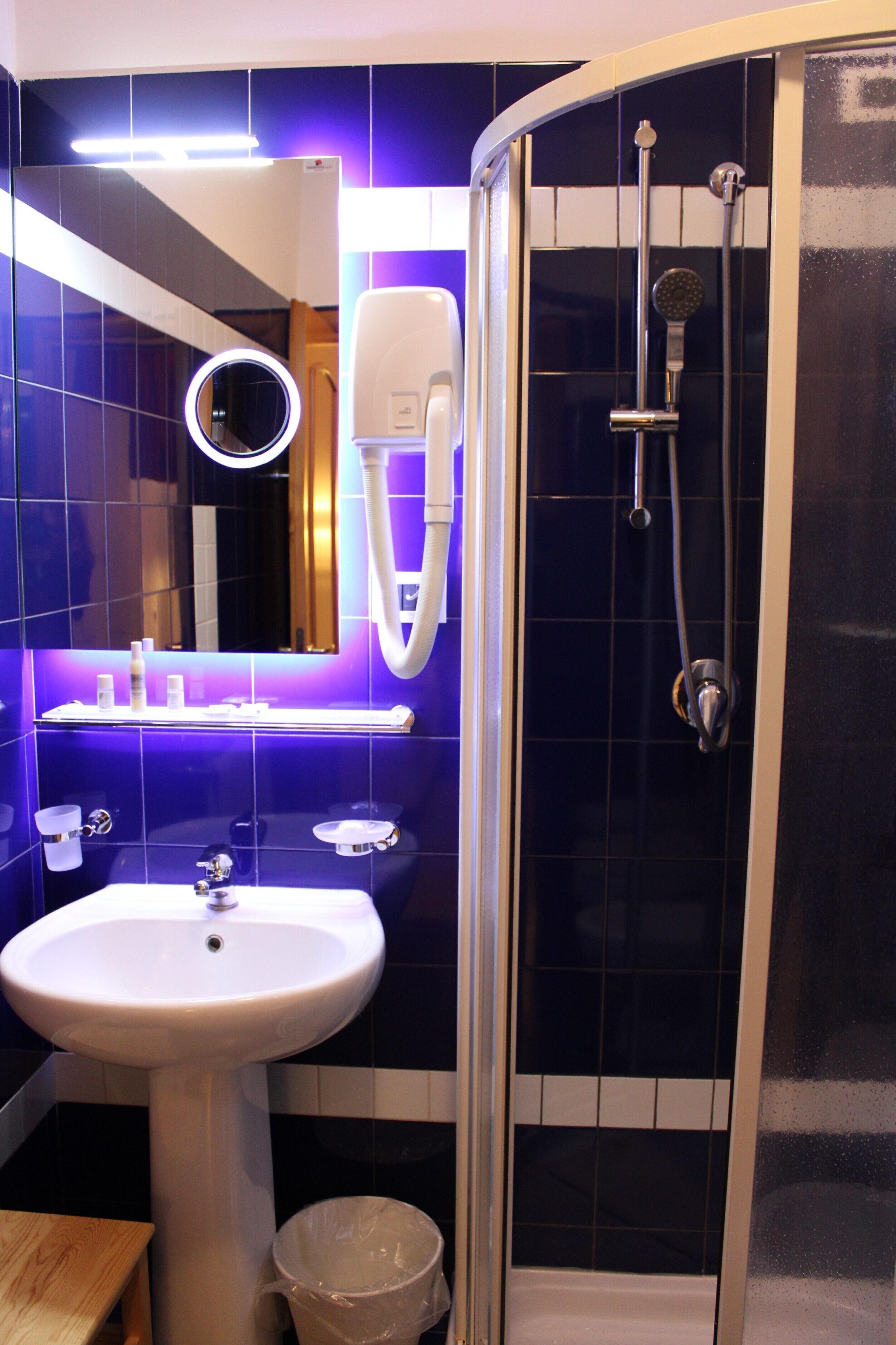 designer toiletries, hair dryer, bidet, towels