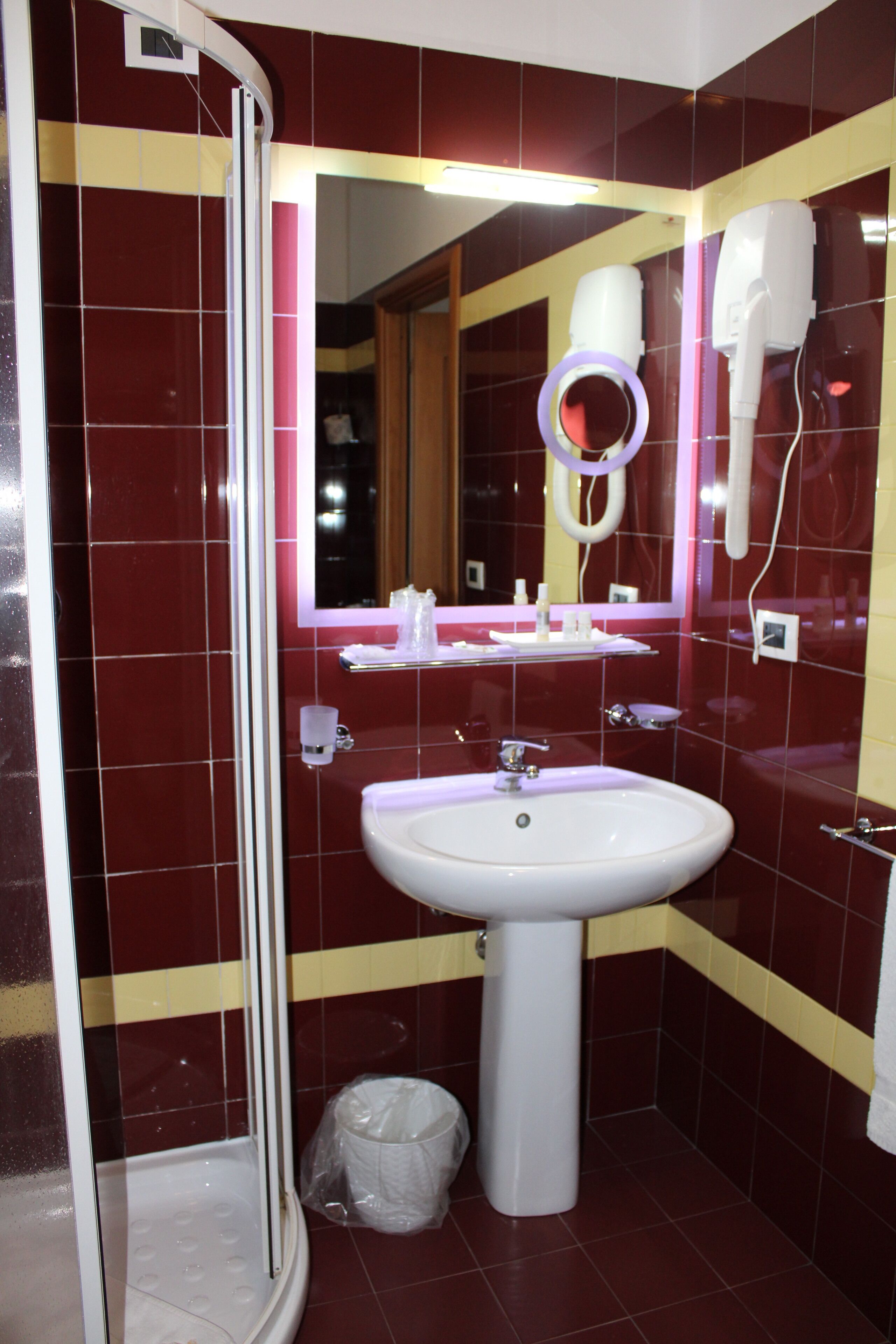 designer toiletries, hair dryer, bidet, towels