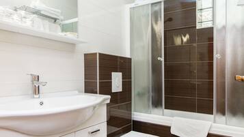 Studio, Balcony | Bathroom | Combined shower/tub, deep soaking tub, free toiletries, hair dryer