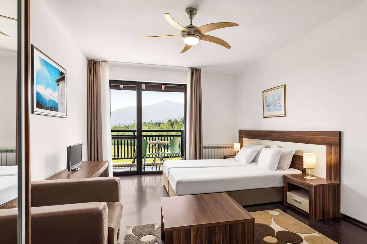 Premium bedding, memory-foam beds, in-room safe, desk