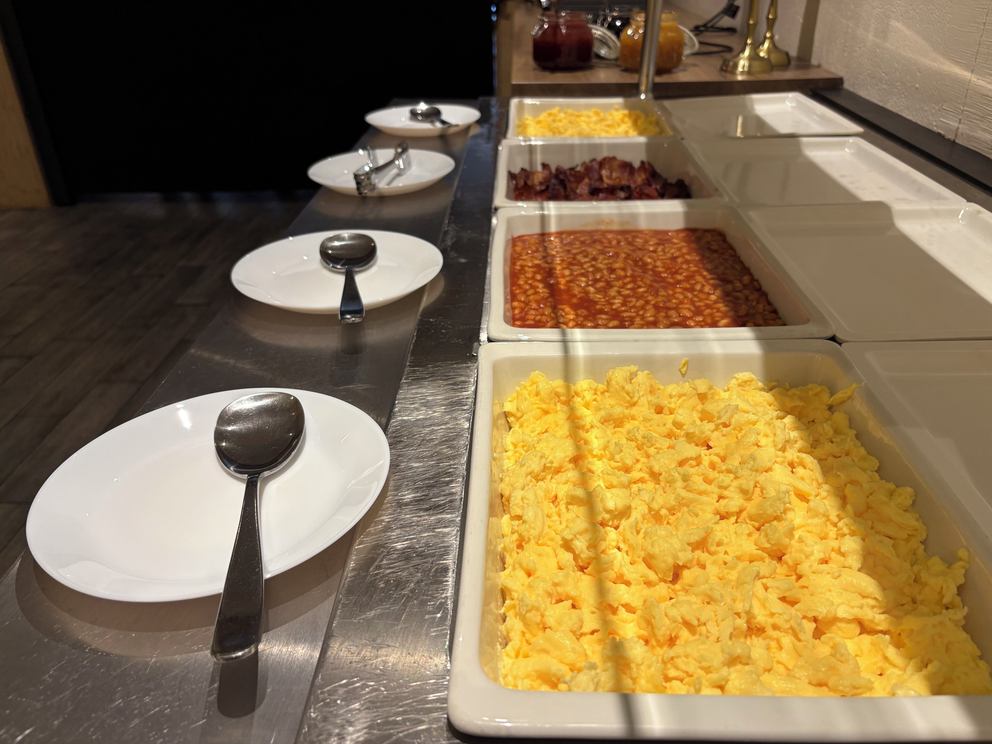 A buffet table with various food options.