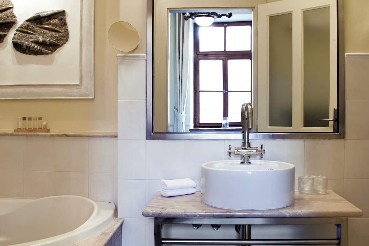 designer toiletries, hair dryer, bathrobes, slippers