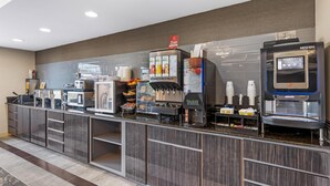 A self-service beverage station with multiple drink dispensers, a coffee machine, and a Nescafé branded coffee maker. - Best Western Plus Glen Allen Inn (Glen Allen)