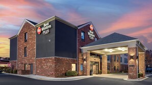 A hotel with a modern brick facade, a covered entrance, and signage for 'Best Western PLUS' and 'BW.' - Best Western Plus Glen Allen Inn (Glen Allen)