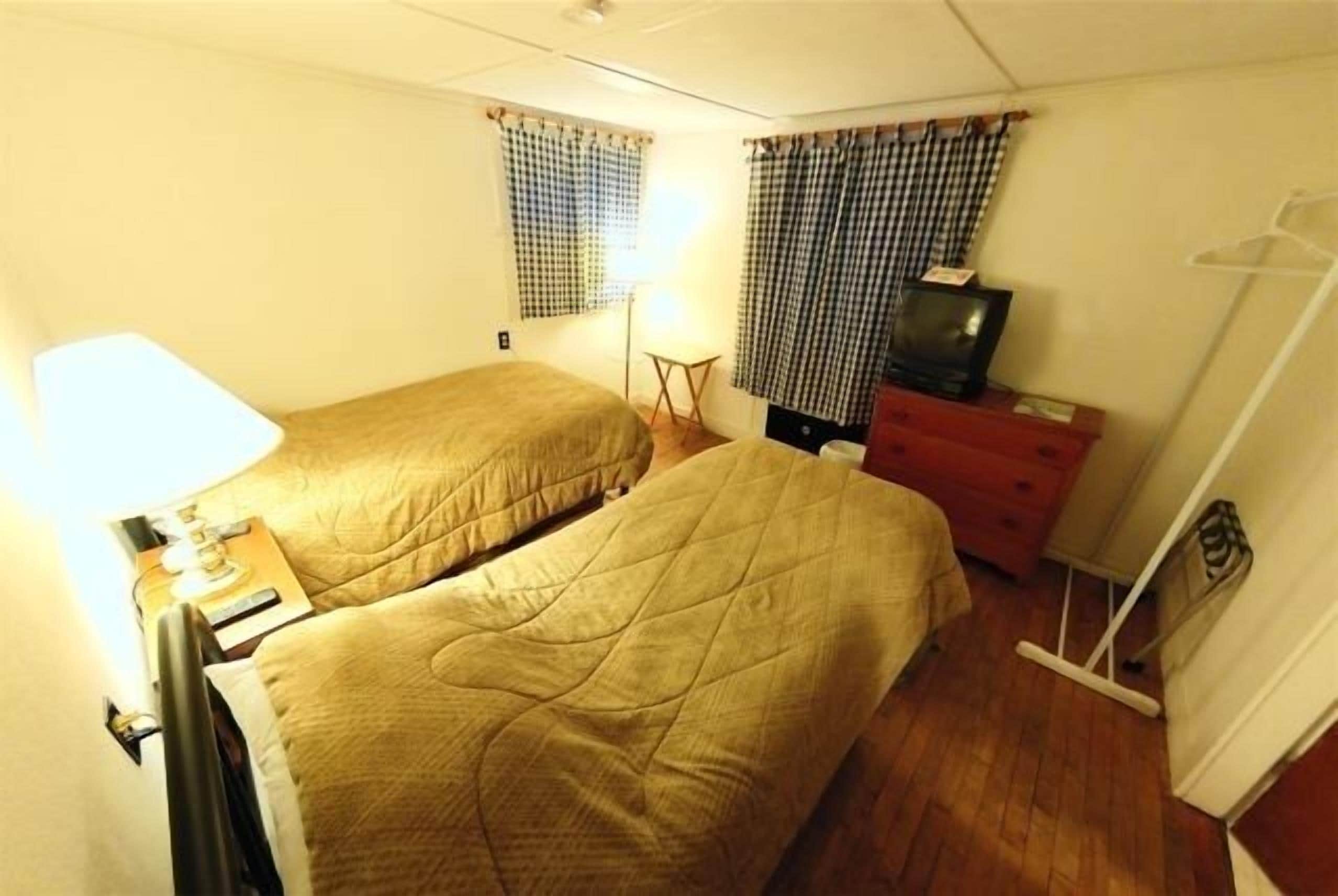 two twin bed room with private bathroom (pets not allowed) | blackout curtains, free wifi, bed sheets, alarm clocks