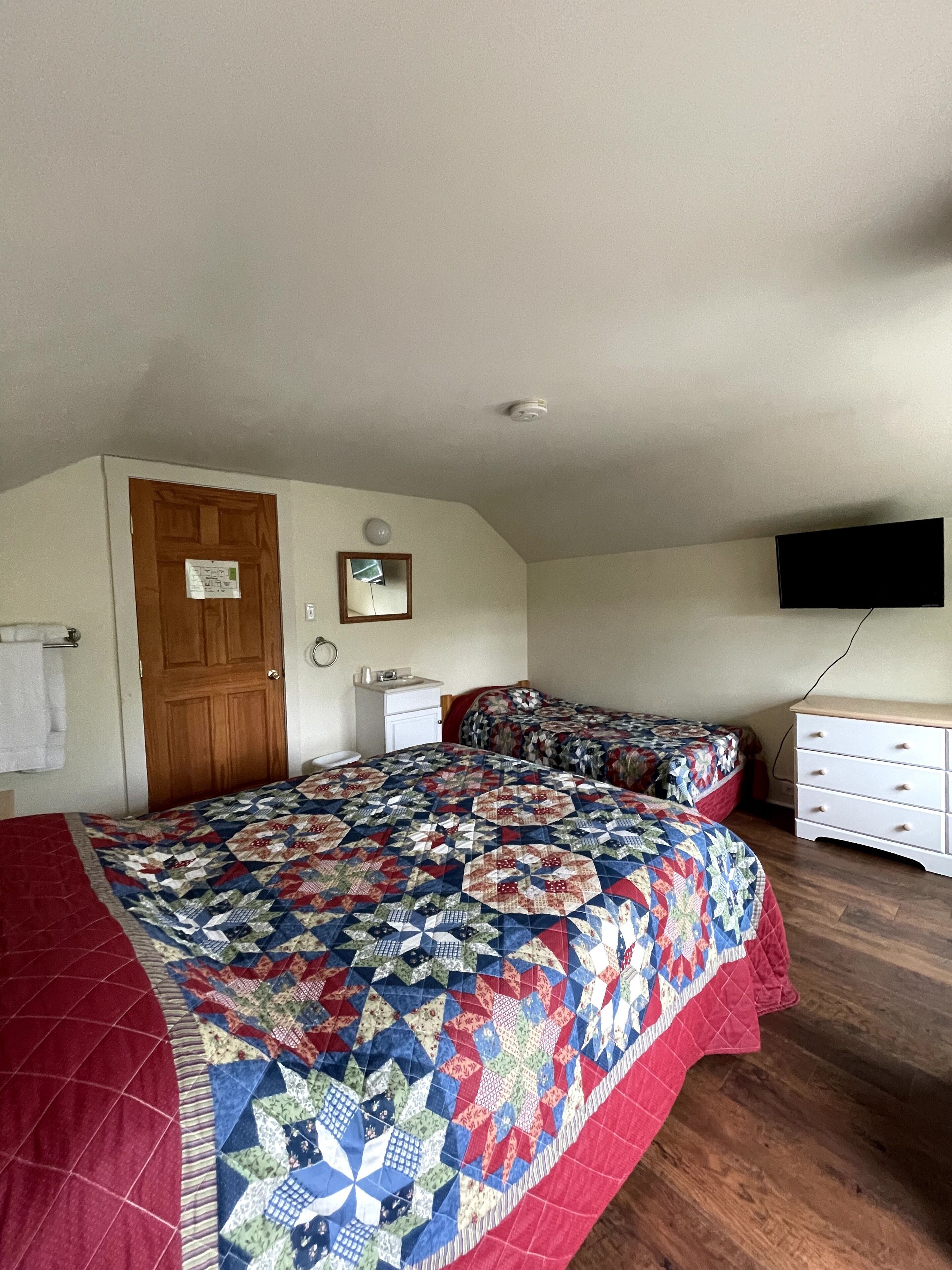 queen and twin room with shared bathroom (pets not allowed) | blackout curtains, free wifi, bed sheets, alarm clocks