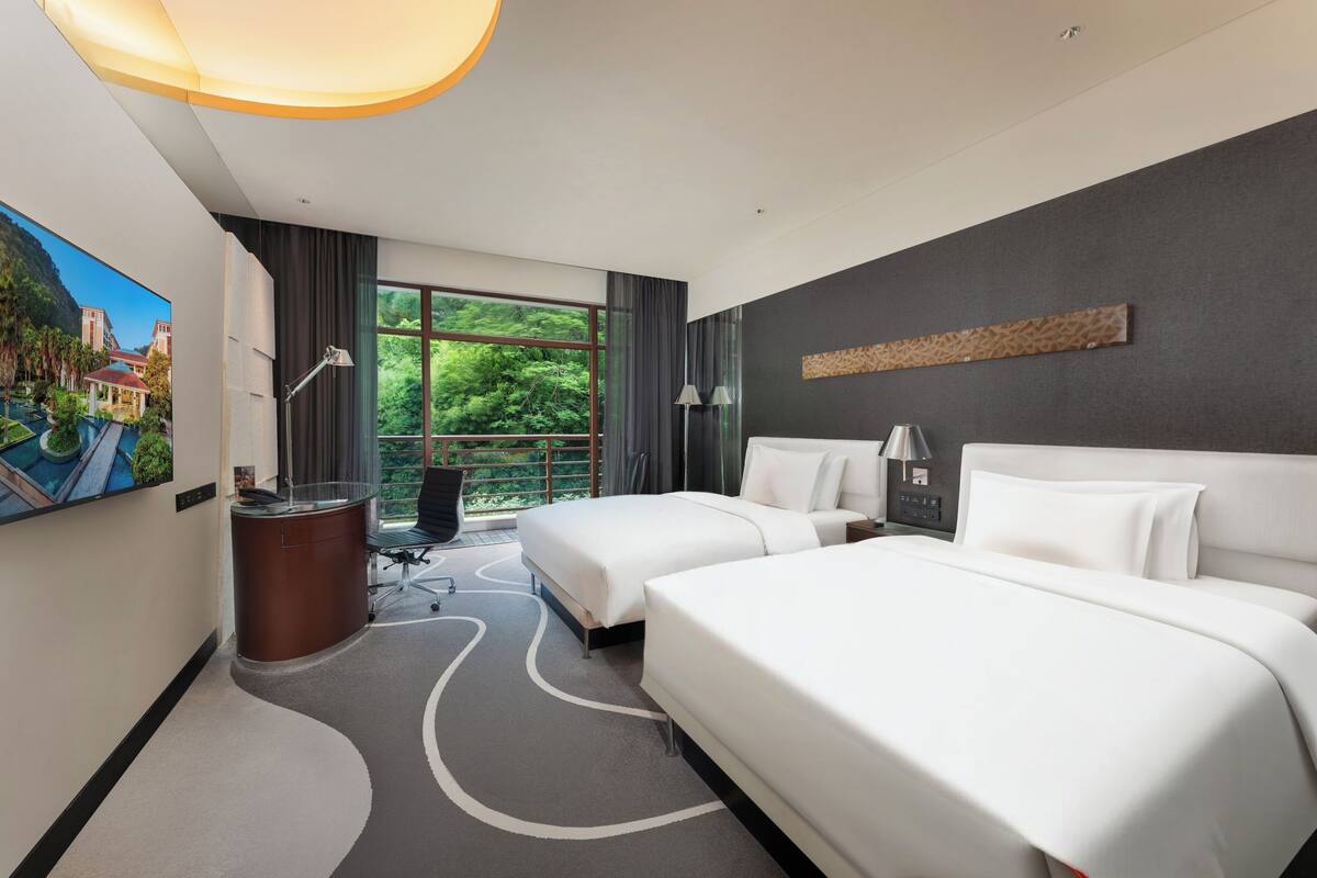 Premium bedding, down comforters, pillowtop beds, minibar