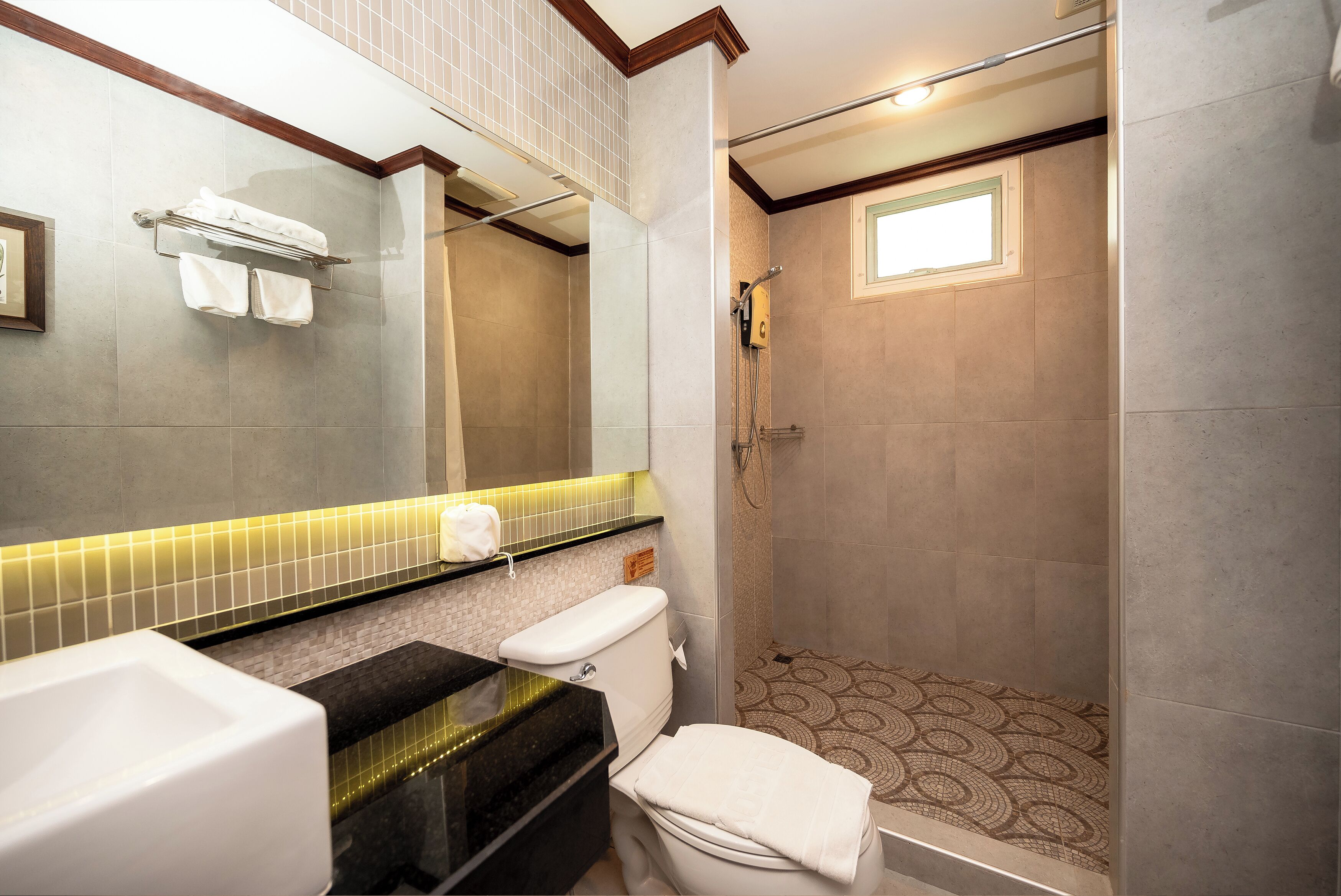 deluxe room | bathroom | designer toiletries, hair dryer, towels