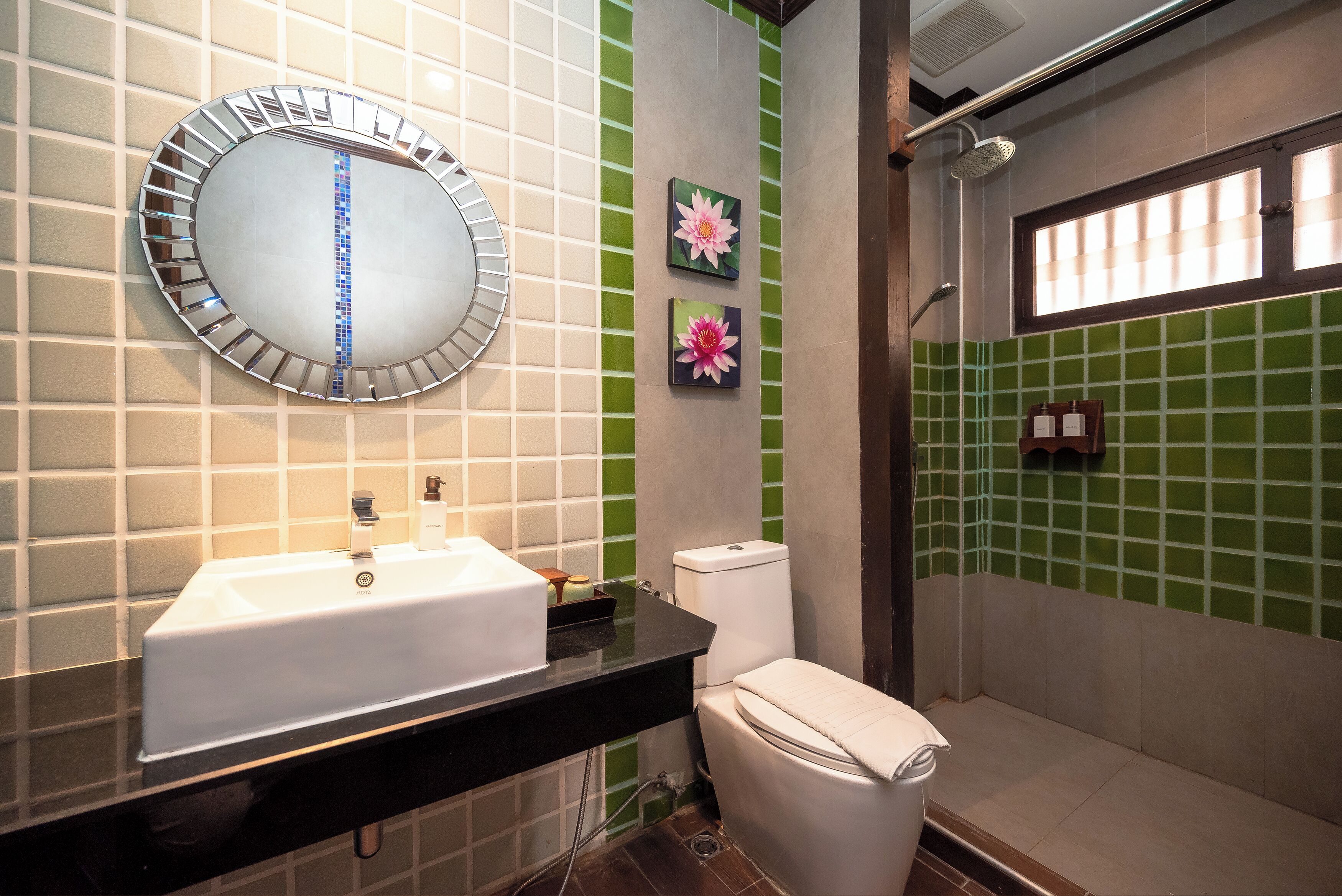 deluxe room | bathroom | designer toiletries, hair dryer, towels