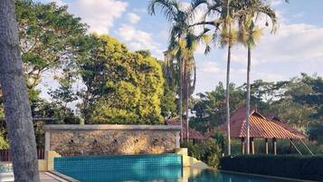 Outdoor pool, open 8:00 AM to 7:00 PM, free cabanas, pool umbrellas