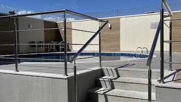 Outdoor pool, pool umbrellas, sun loungers