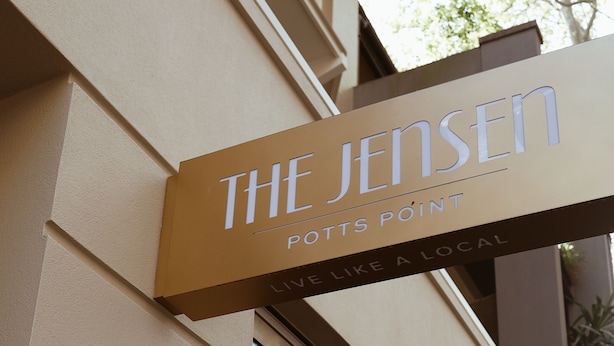 A building with a sign reading "The Jensen" and "POTTS POINT" indicating the hotel's name and location.