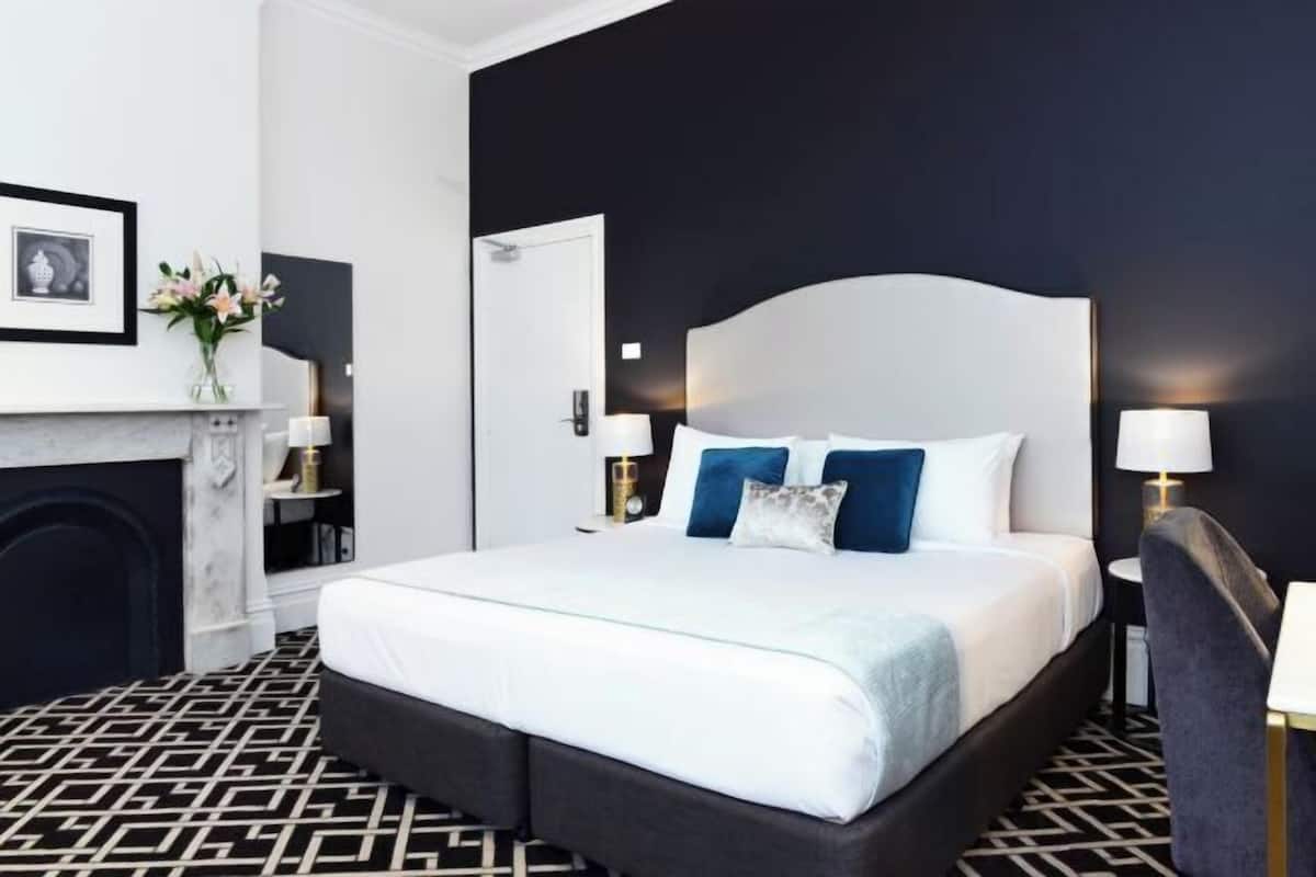 Premium bedding, desk, laptop workspace, blackout curtains