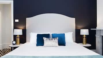 Premium bedding, desk, laptop workspace, blackout drapes