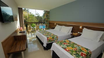 Deluxe Room, Pool View | Minibar, in-room safe, desk, laptop workspace