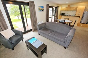 2 Bedroom Cottage | Living room | 21-inch flat-screen TV with satellite channels, TV
