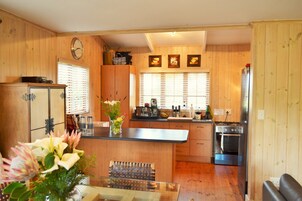 Superior Cottage (Fully Equipped, Self Catering) | Private kitchen | Full-size fridge, microwave, oven, stovetop