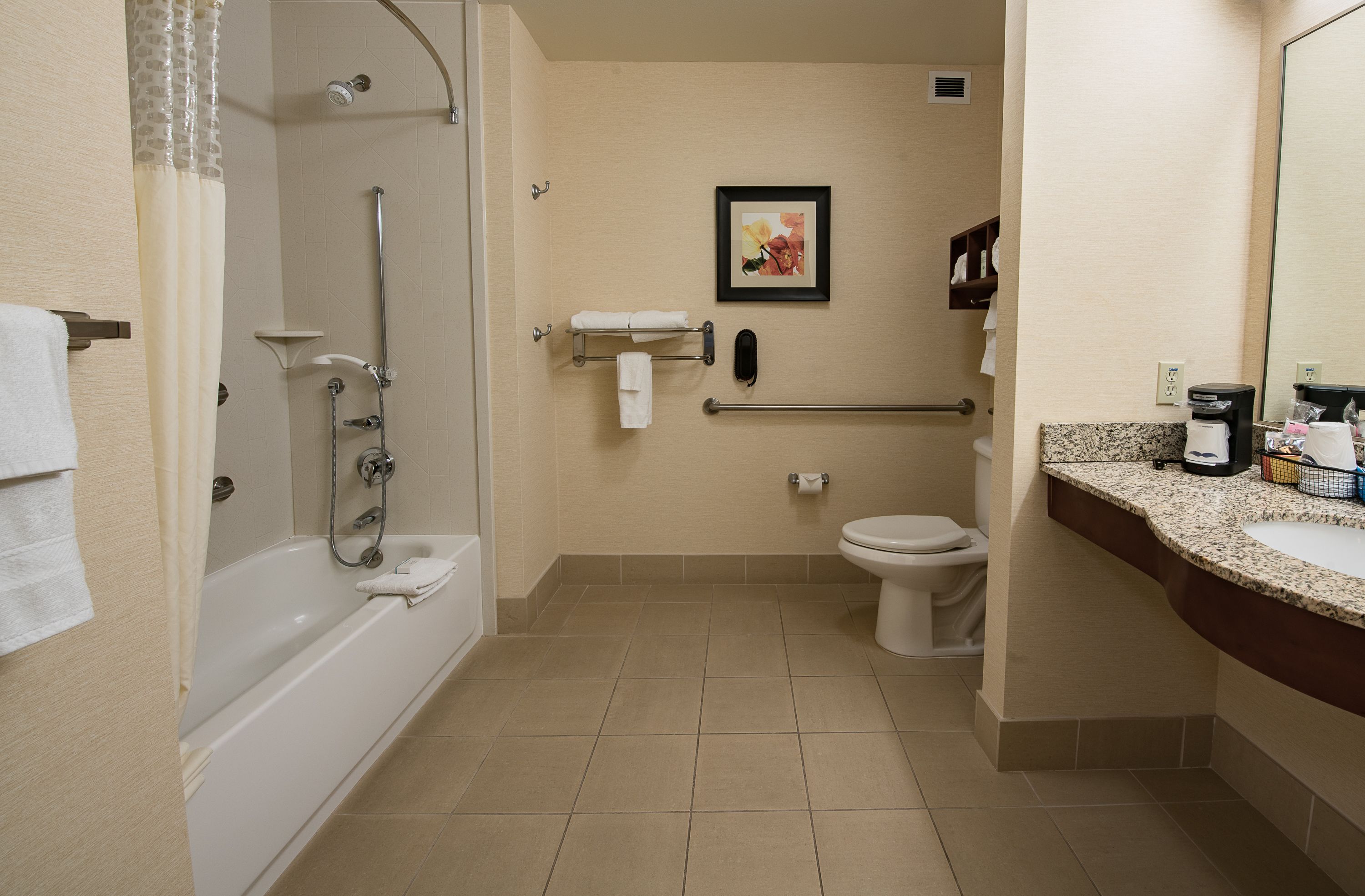 combined shower/bathtub, free toiletries, hair dryer, towels