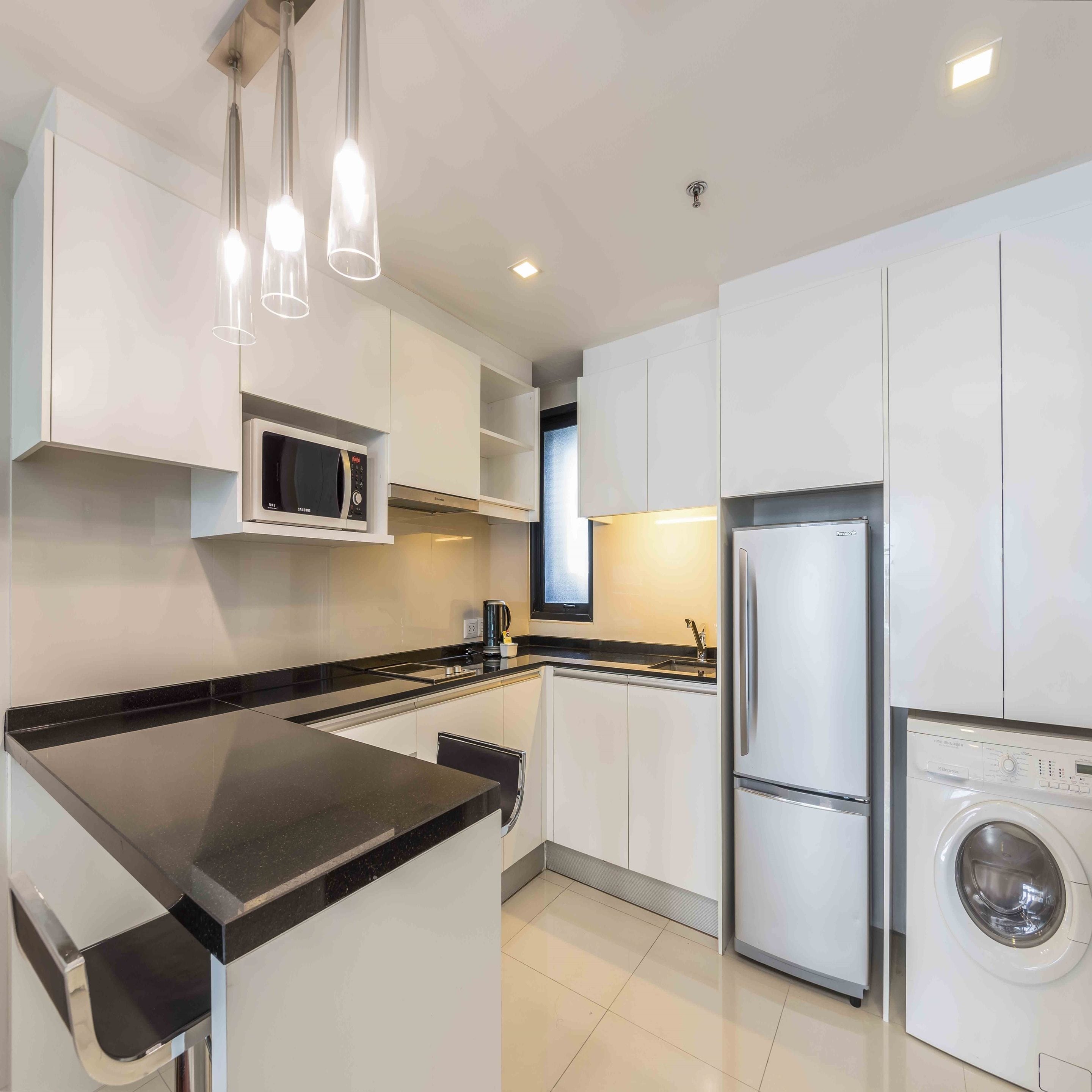 one bedroom deluxe | private kitchen | full-sized fridge, microwave, stovetop, coffee/tea maker