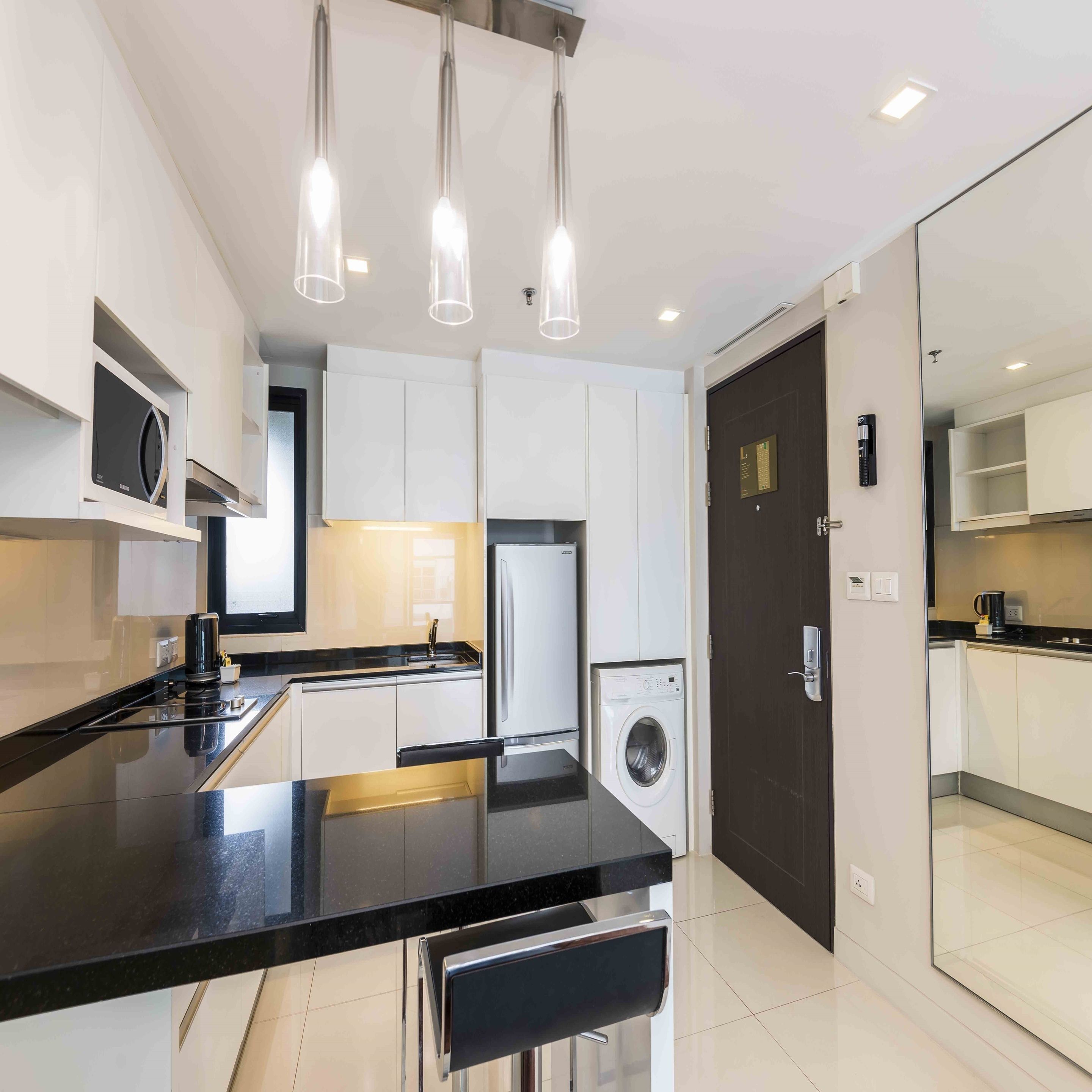 one bedroom deluxe | private kitchen | full-sized fridge, microwave, stovetop, coffee/tea maker