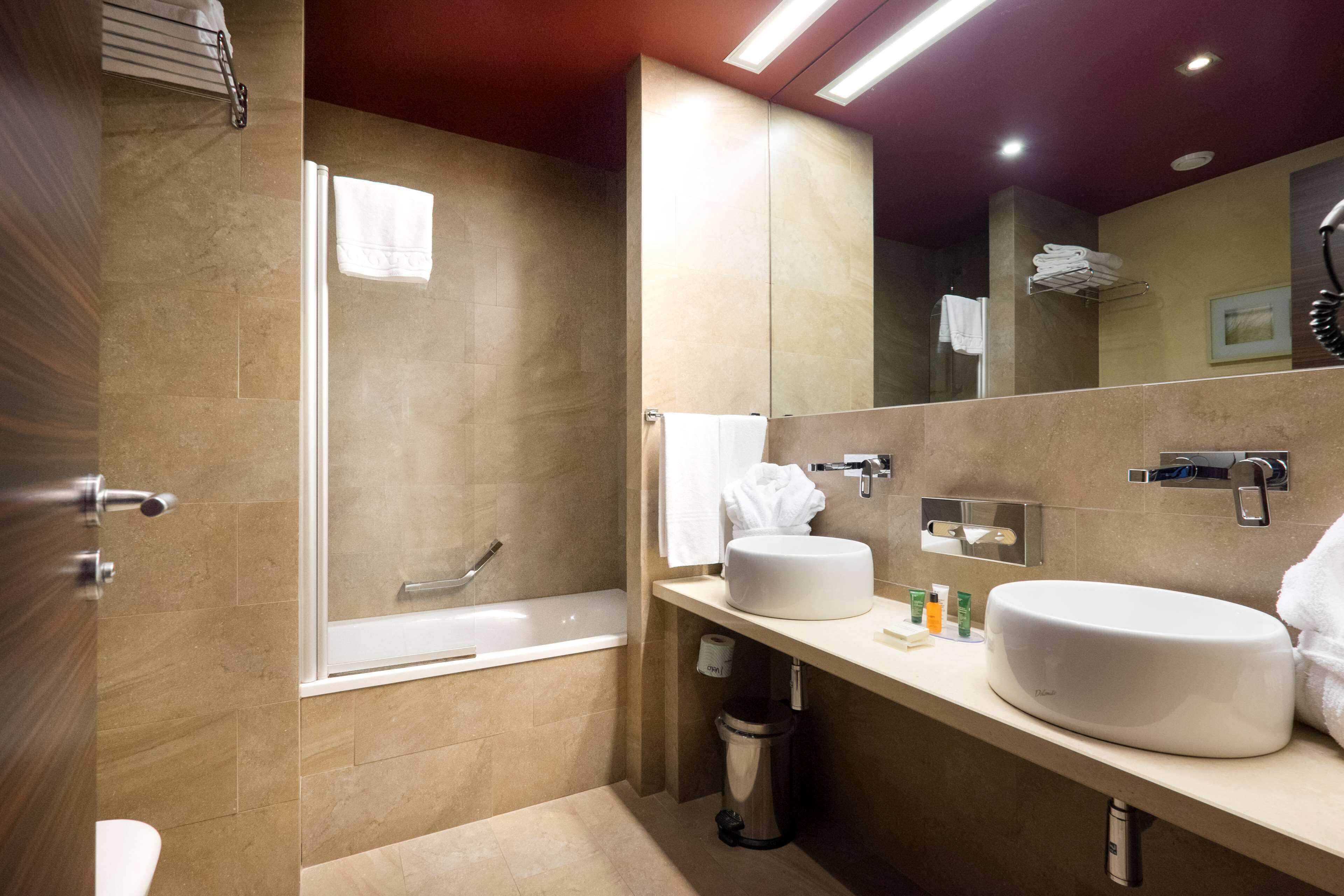 family suite, 1 king bed | bathroom | designer toiletries, hair dryer, bidet, towels