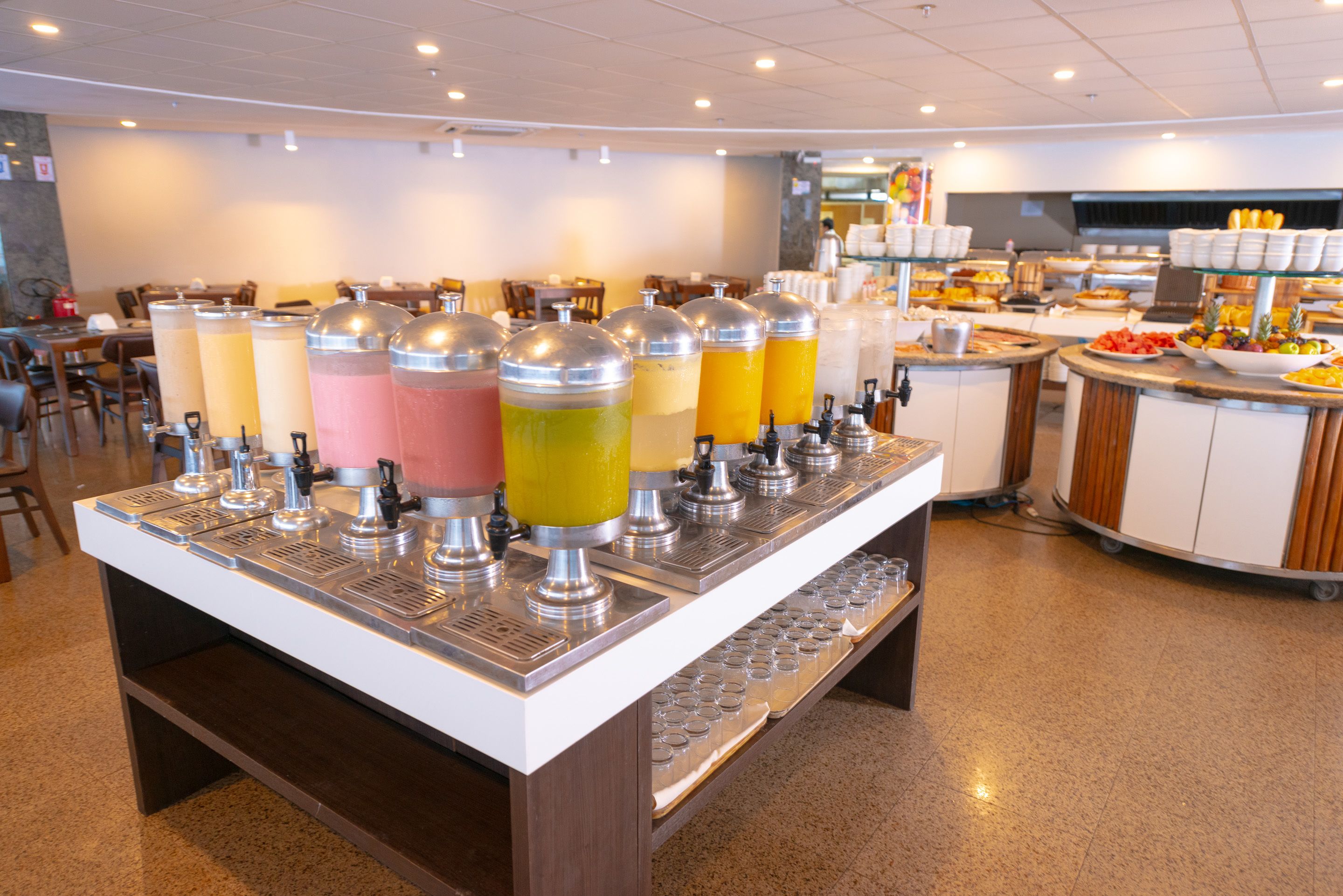 A buffet area with various food and drink dispensers.