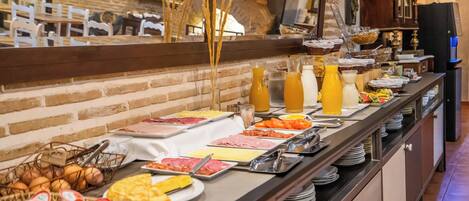 A buffet with various food items and beverages.
