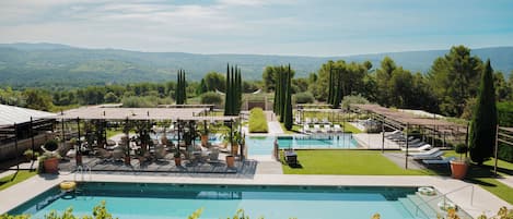 Indoor pool, 2 outdoor pools, open 9:00 AM to 6:00 PM, pool umbrellas