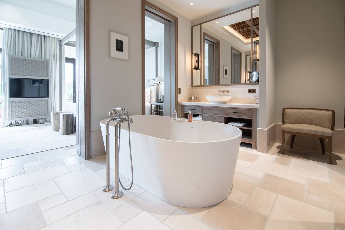 ida suite | bathroom | separate bathtub and shower, deep-soaking bathtub