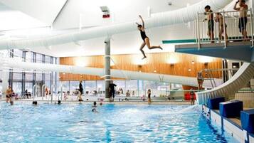 Swimmers can enjoy the pool with multiple lanes and a diving platform.