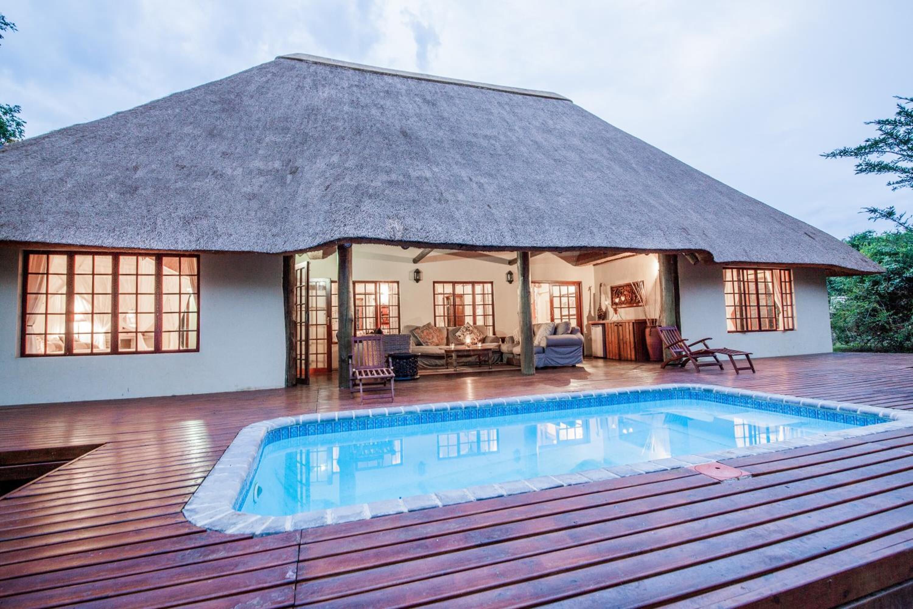 Outdoor pool, open 6 AM to 10 PM, pool loungers