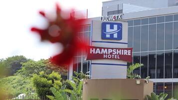 A hotel building with a sign for Outworth Hotel and Hampshire Hotel.