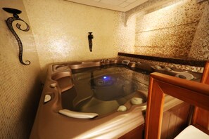 A hot tub with a control panel, surrounded by tiled walls and wooden furniture. - Holiday Inn Club Vacations The Royal Haciendas by IHG - All inclusive (Playa del Carmen)