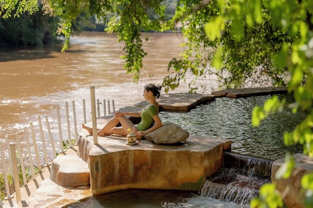 Outdoor pool, sun loungers. Hintok River Camp at Hellfire Pass