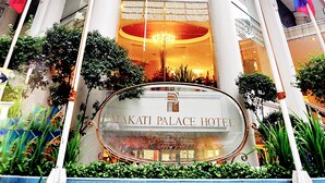 The Makati Palace Hotel entrance with a large sign, columns, and a chandelier. - Makati Palace Hotel (Makati)