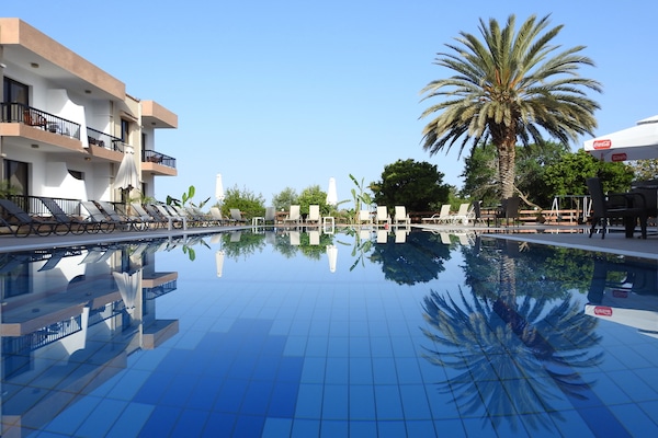 Seasonal outdoor pool, open 8:00 AM to 7:30 PM, pool umbrellas