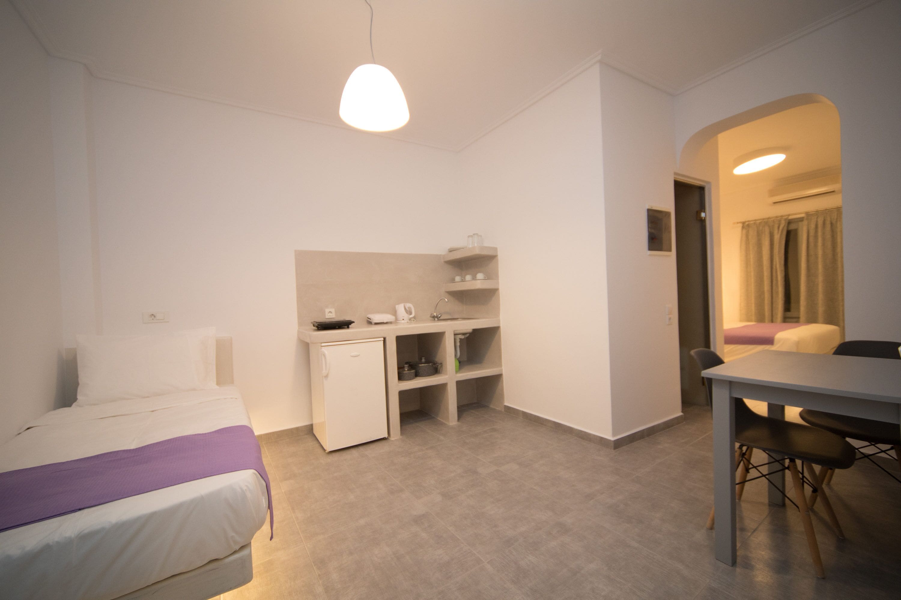 Kamar Triple Deluks | Dapur pribadi | Lemari es, kompor, ketel listrik, dan peralatan masak/sendok-piring