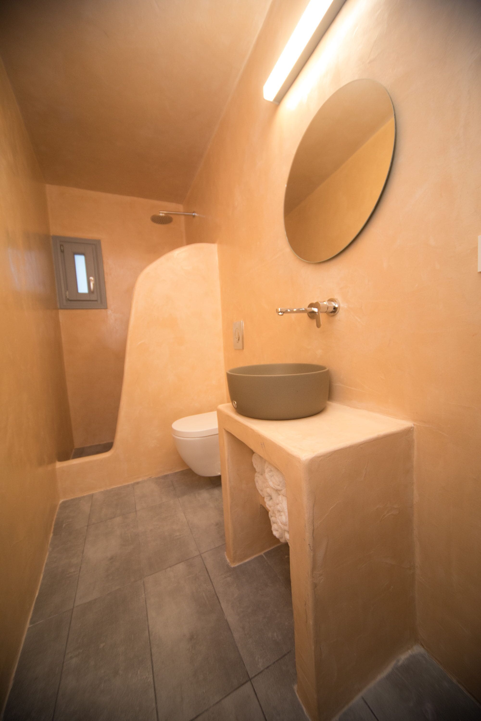 A bathroom with a bathtub, toilet, and sink.